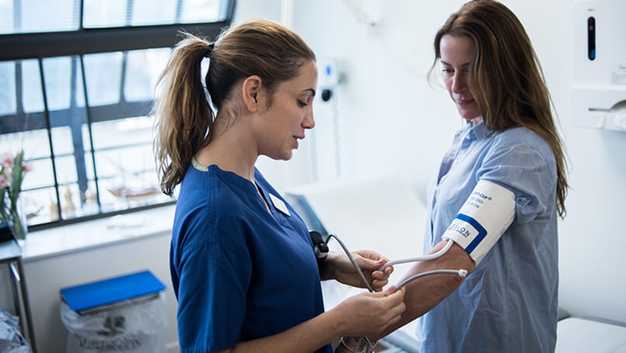 Nurse taking a patient's blood pressure